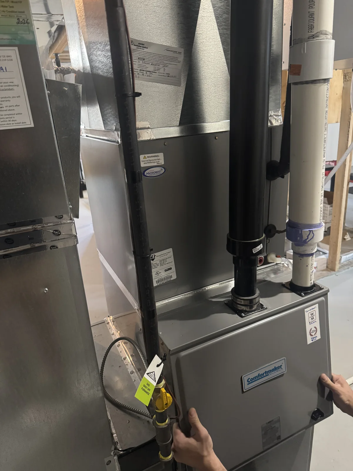 High-efficiency furnace installation in a Chestermere mechanical room